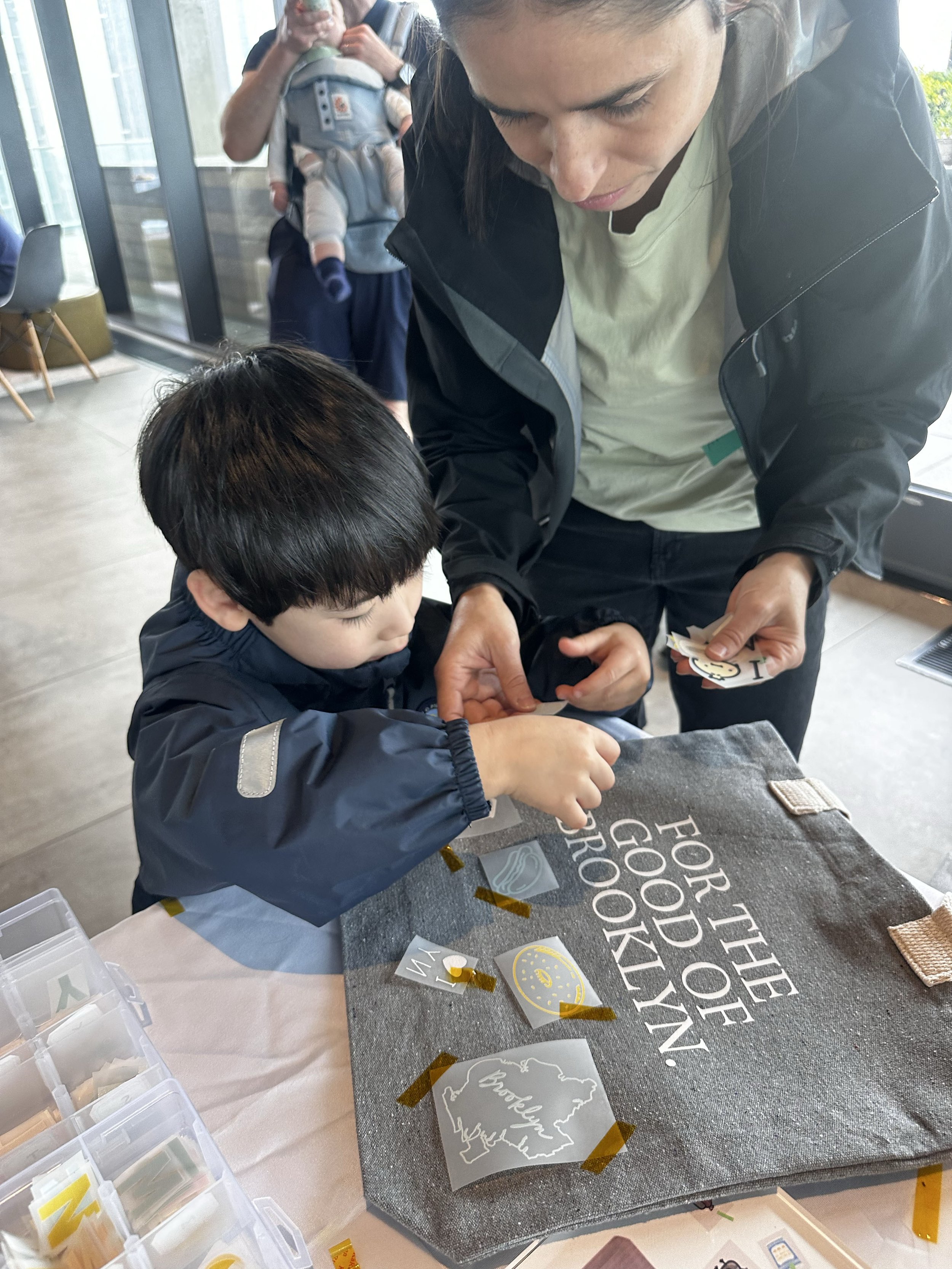Mom and son making tote bags
